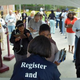 Board of Elections Customer Service Supervisor Sabrina German hands out absentee ballots during early voting Oct. 23, 2008, in Savannah, Ga.
Stephen Morton/Getty Images